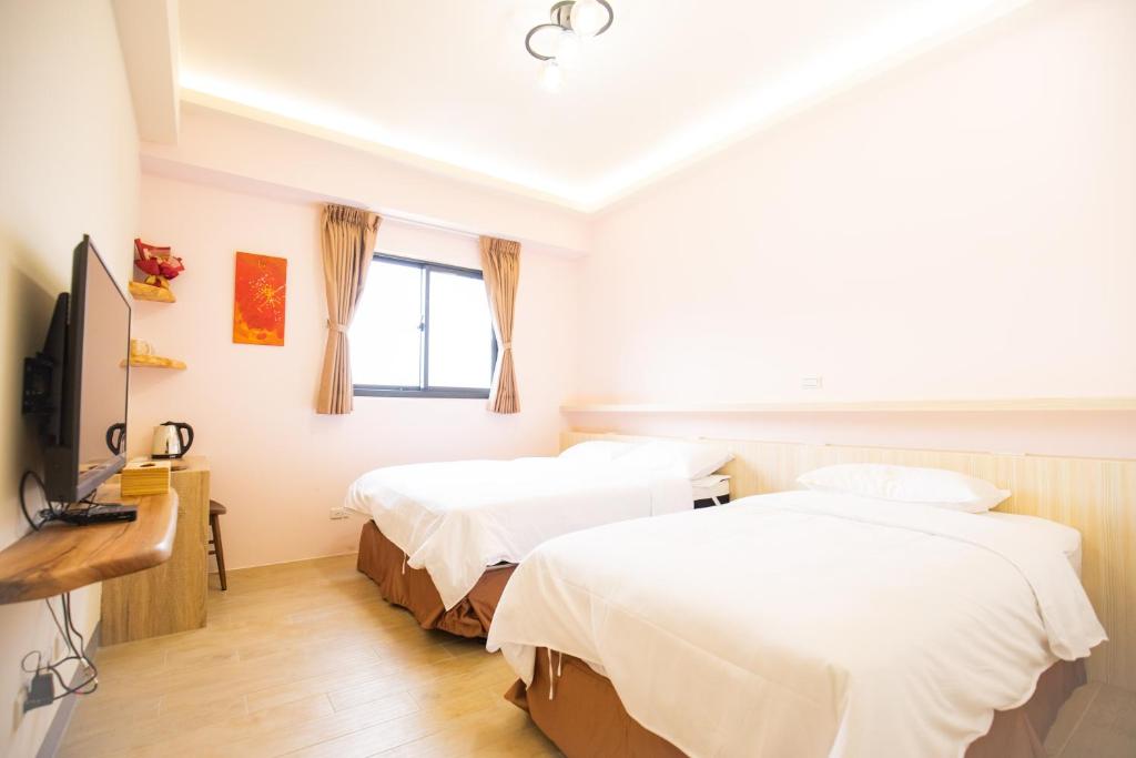 Postel nebo postele na pokoji v ubytování 亞窩行館 Yao Guesthouse