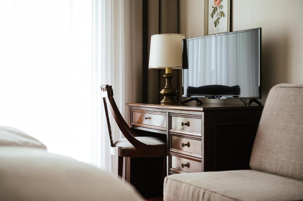 TV a/nebo společenská místnost v ubytování Hotel Isabella
