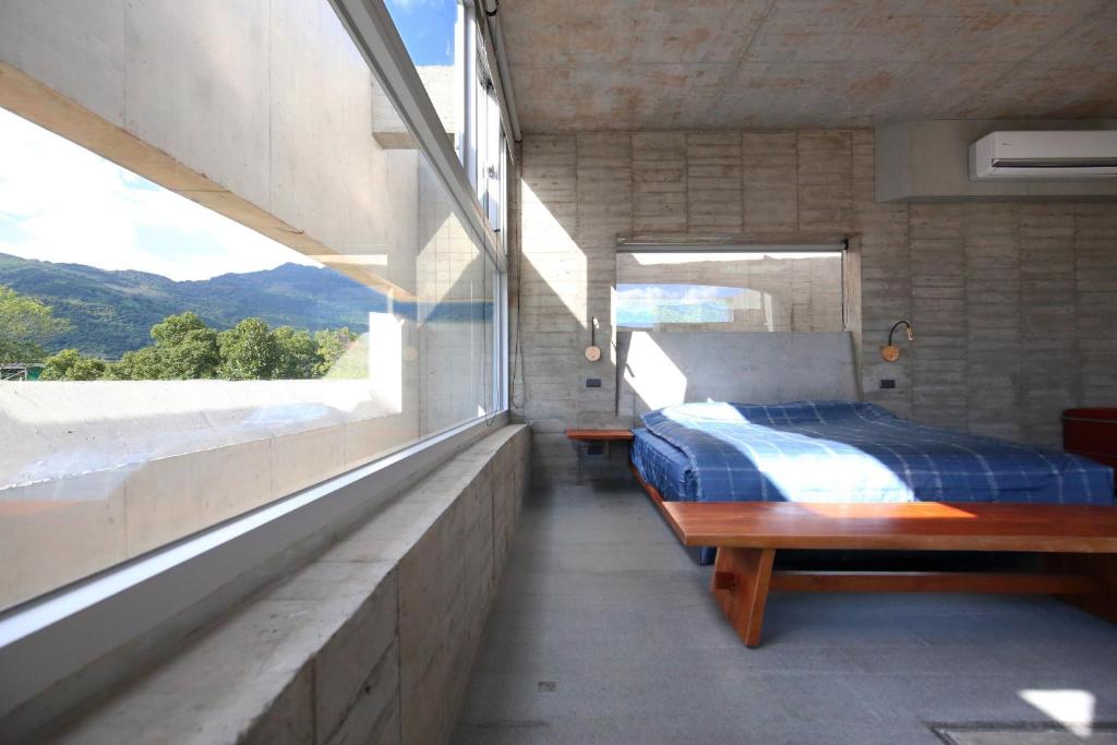 Postelja oz. postelje v sobi nastanitve Penlai Home