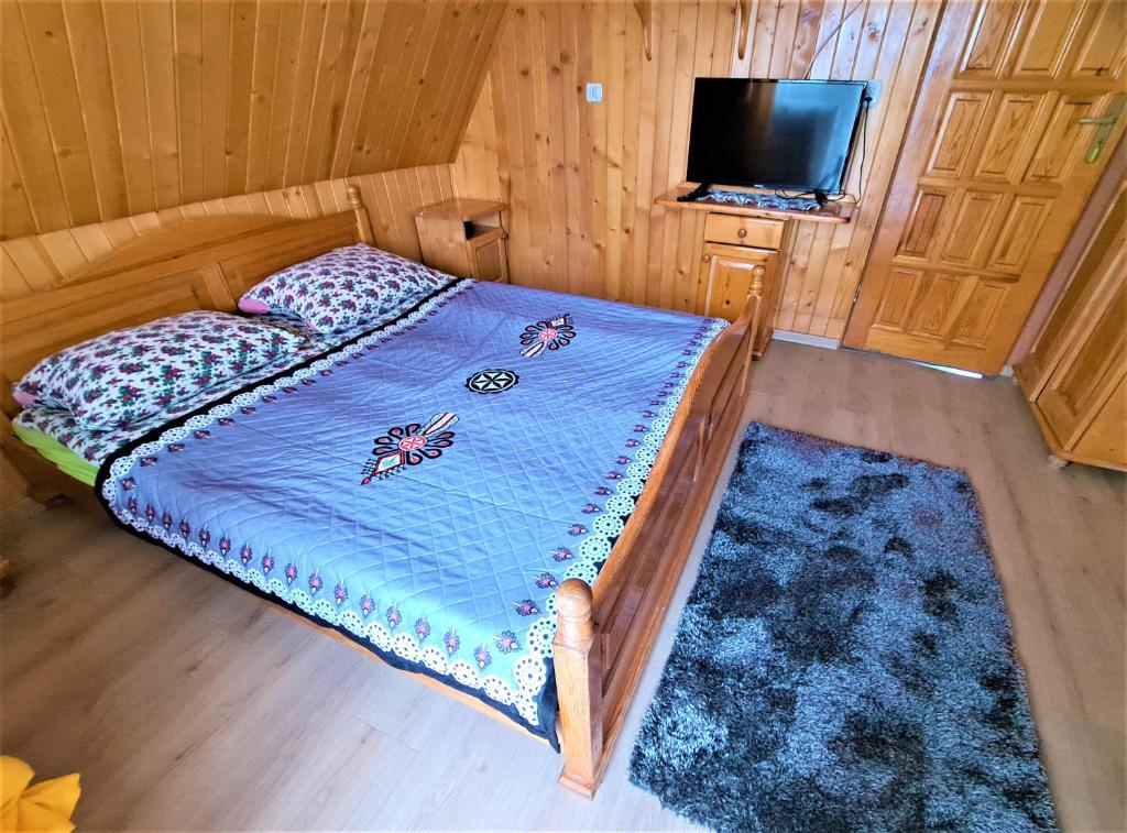 Posteľ alebo postele v izbe v ubytovaní "Harnaś" Ząb-Bustryk