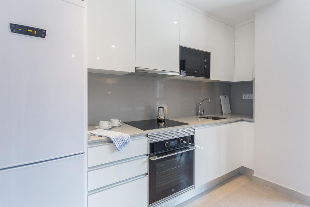Kuchyň nebo kuchyňský kout v ubytování Apartamento Las Canteras Beachway