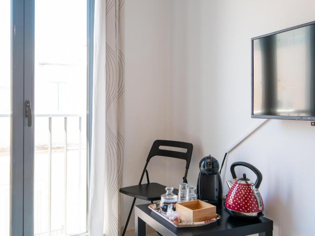 Televízia a/alebo spoločenská miestnosť v ubytovaní Apartamento LABORT Apartamento Boutique