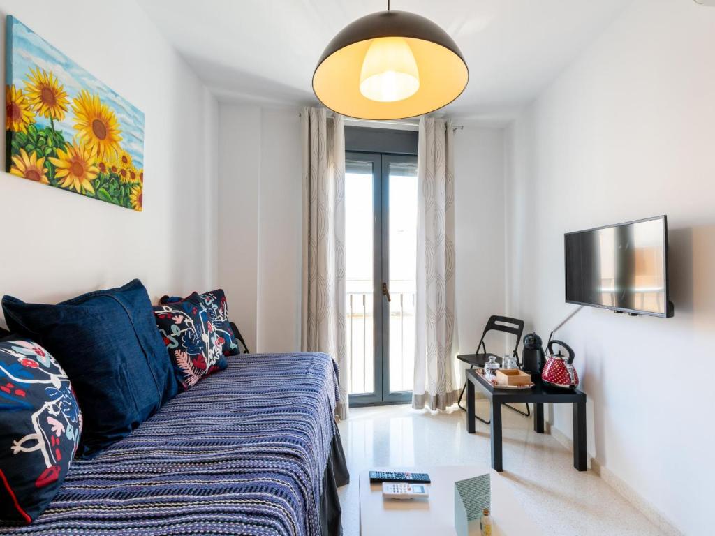 Televízia a/alebo spoločenská miestnosť v ubytovaní Apartamento LABORT Apartamento Boutique