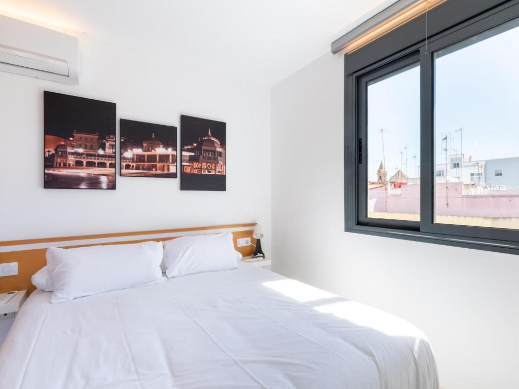 Posteľ alebo postele v izbe v ubytovaní Apartamento LABORT Apartamento Boutique