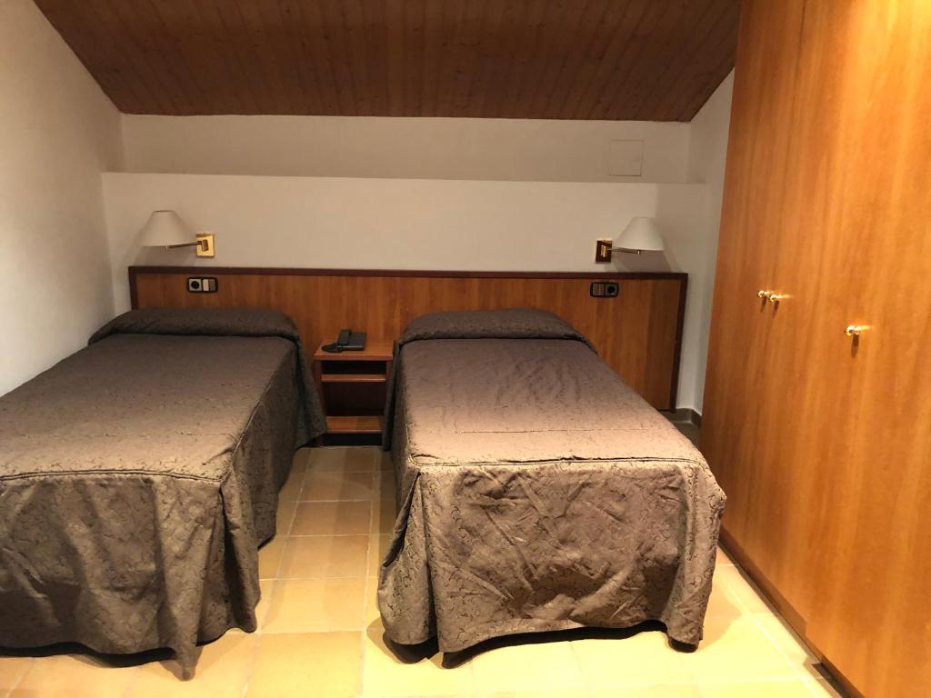 Postel nebo postele na pokoji v ubytování Hotel Refugi dels Isards