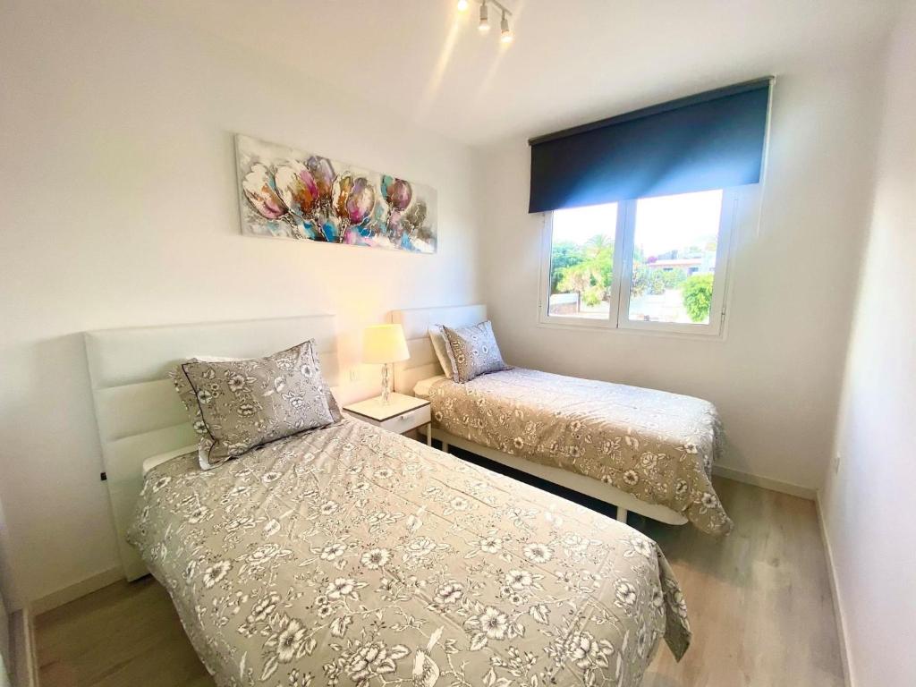 Posteľ alebo postele v izbe v ubytovaní Luxury Atlantico View