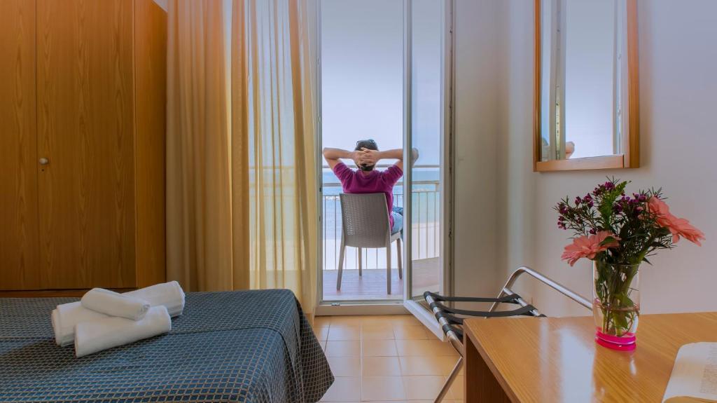 Postel nebo postele na pokoji v ubytování Hotel President's