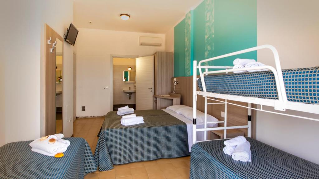 Postel nebo postele na pokoji v ubytování Hotel President's