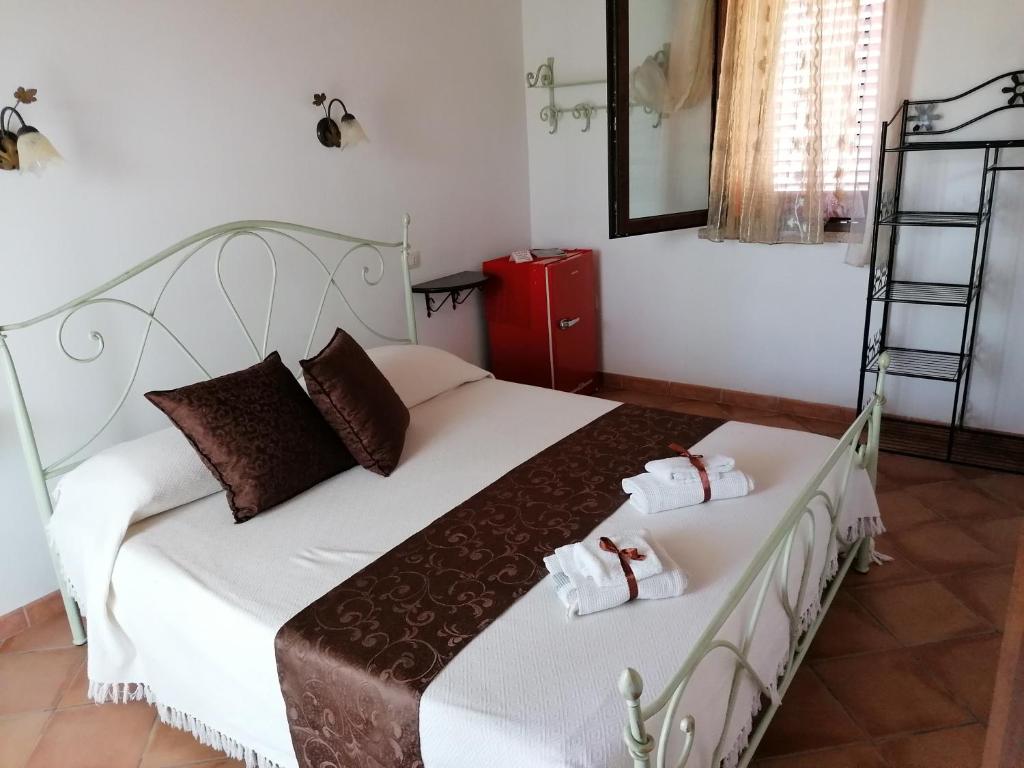 Postel nebo postele na pokoji v ubytování Il Vigneto B&B