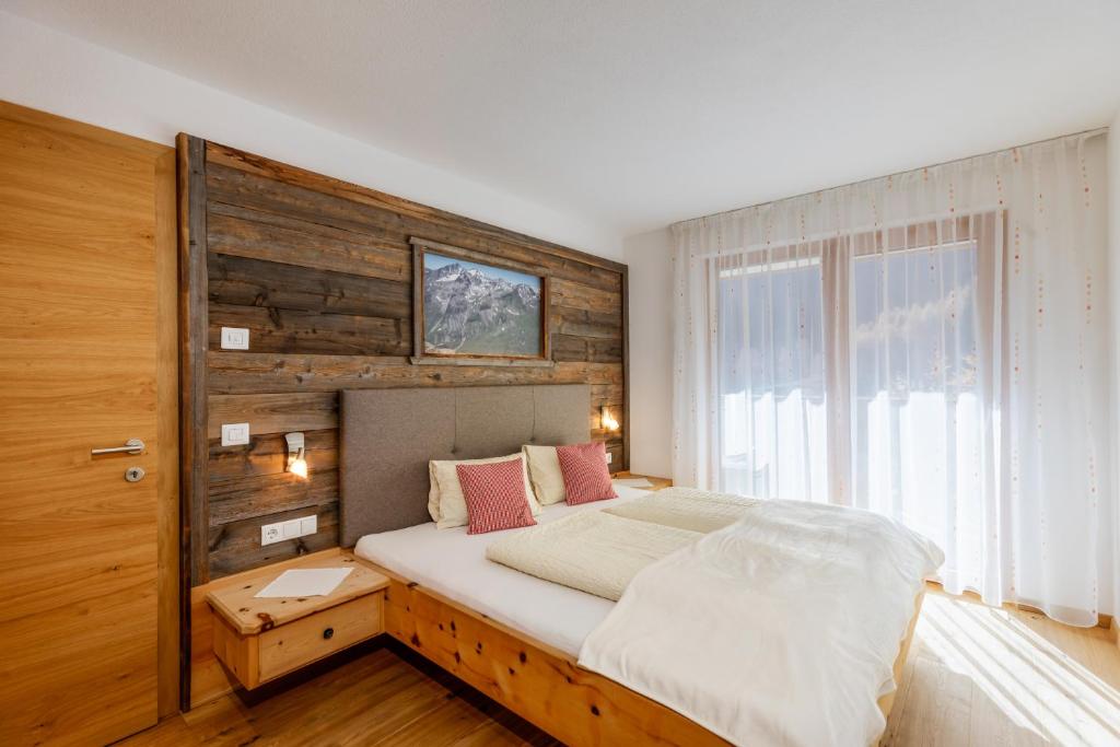 Un pat sau paturi într-o cameră la Zangerlehof