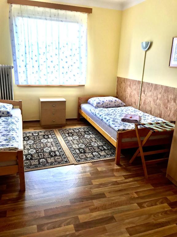 Postel nebo postele na pokoji v ubytování Vila Adéla - Teplice