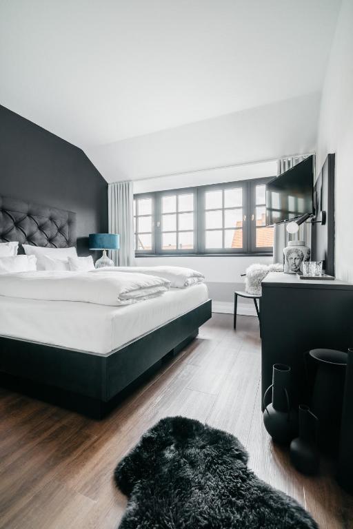 Ein Bett oder Betten in einem Zimmer der Unterkunft Hotel Riesengebirge