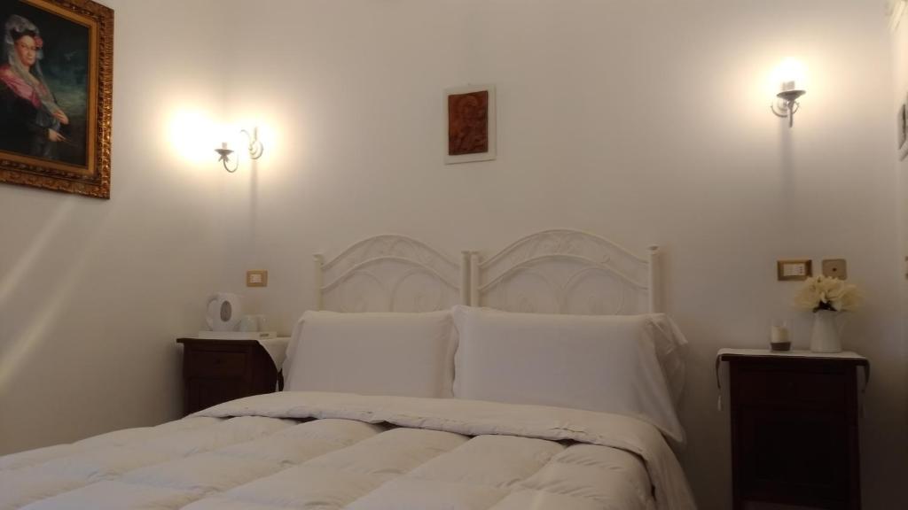 Posteľ alebo postele v izbe v ubytovaní B&B DIMORA PALMIERI