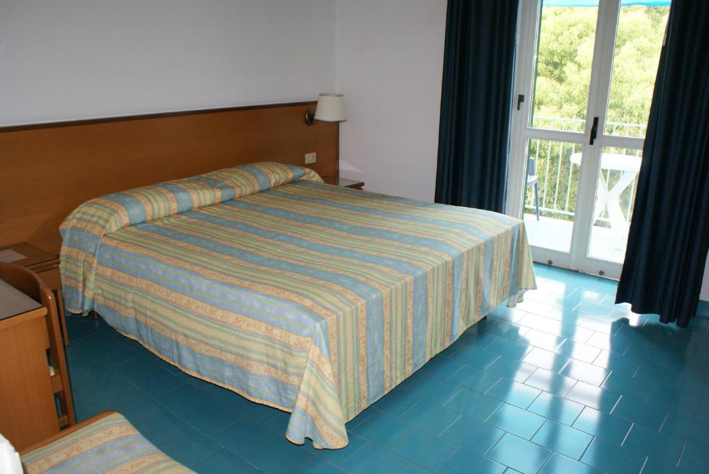 Postel nebo postele na pokoji v ubytování Villa Ciccio