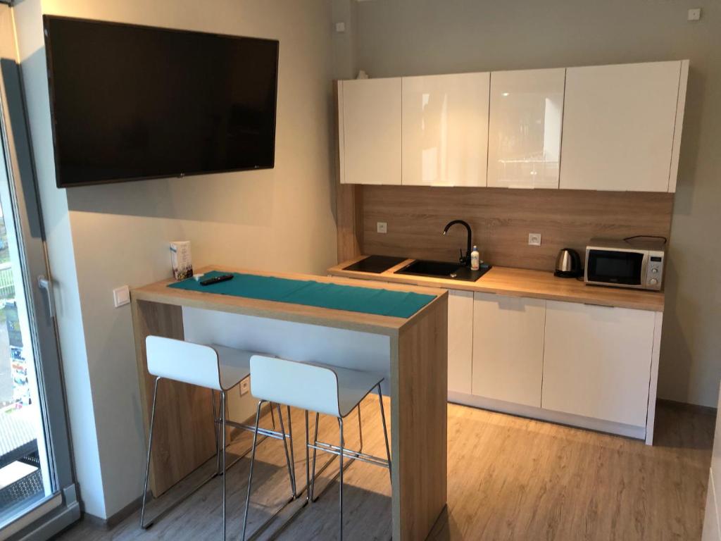 Kuchyňa alebo kuchynka v ubytovaní Baltic Blue Apartamenty Pobierowo