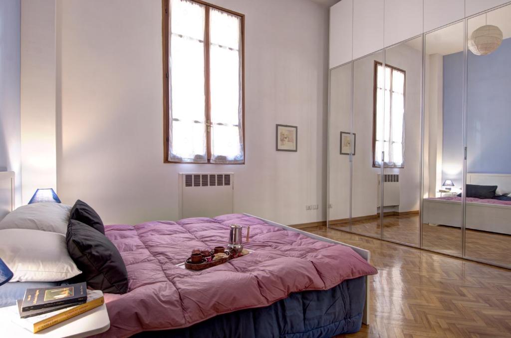Posteľ alebo postele v izbe v ubytovaní GetTheKey Battisti Apartment