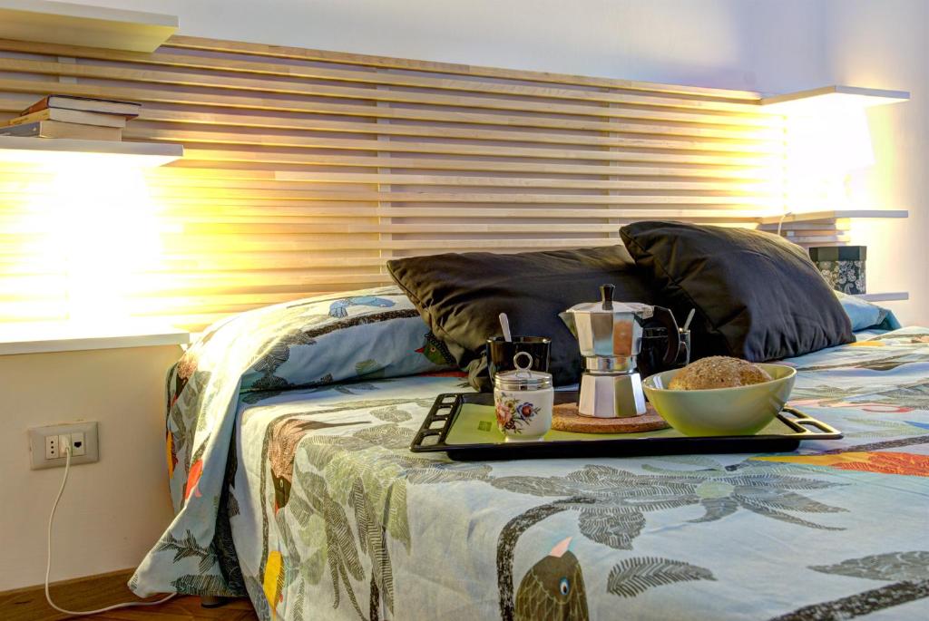 Posteľ alebo postele v izbe v ubytovaní GetTheKey Battisti Apartment