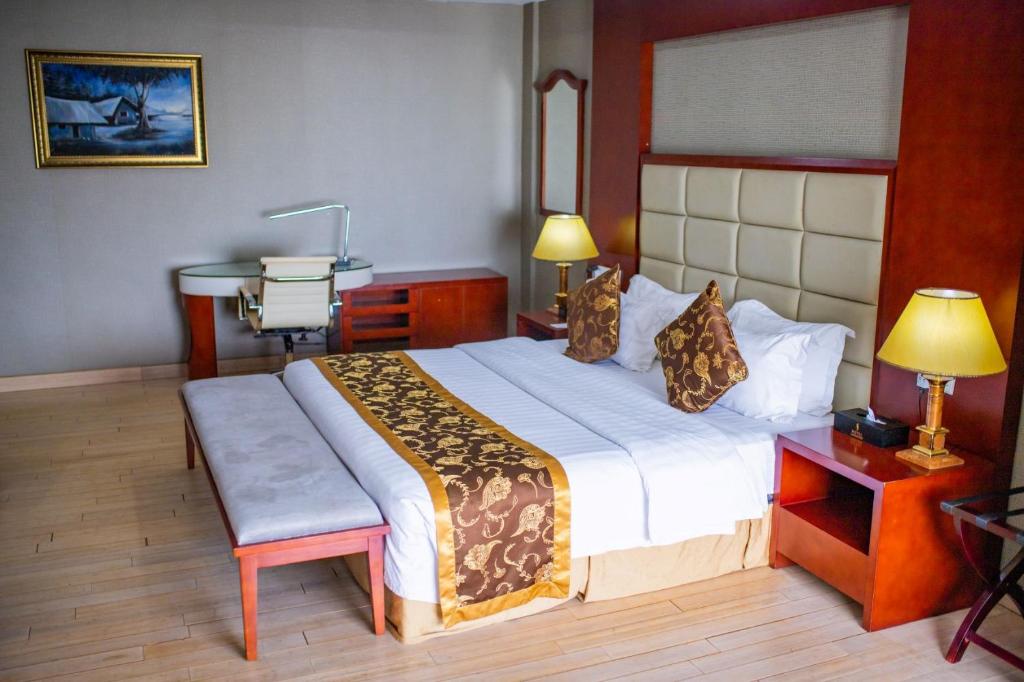 Postel nebo postele na pokoji v ubytování Hotel Sunshine Enugu