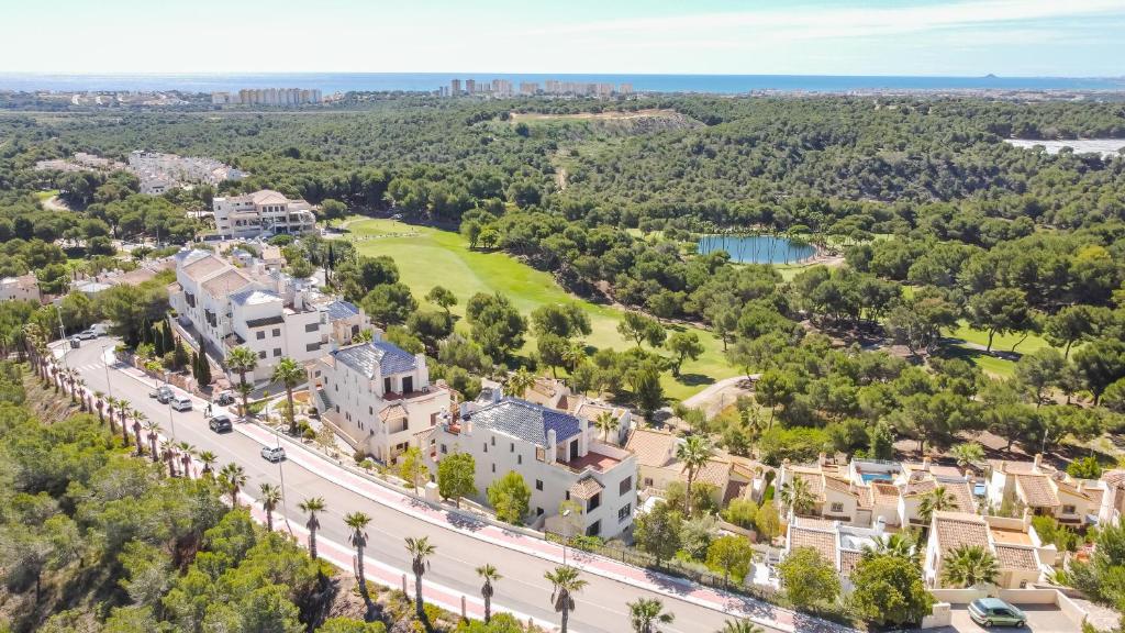 an aerial view of a city with a road and buildings at Appartement Altamira Orihuela Costa Golf, Las Ramblas in Orihuela Costa