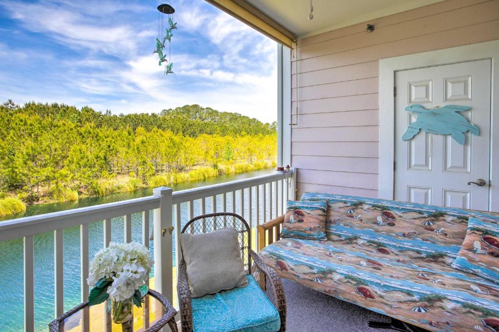 a porch with a couch and a view of the water at Little River Condo with Pool Less Than 6 Mi to Beach! in Little River