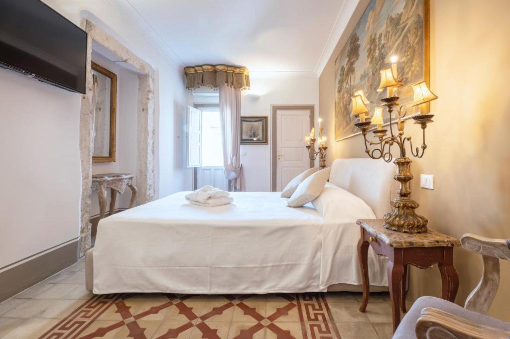 Postel nebo postele na pokoji v ubytování Casa Modica - Luxury rooms