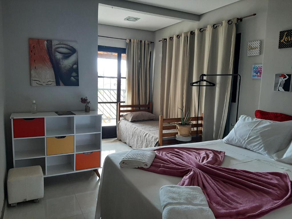 מיטה או מיטות בחדר ב-Pousada Luar