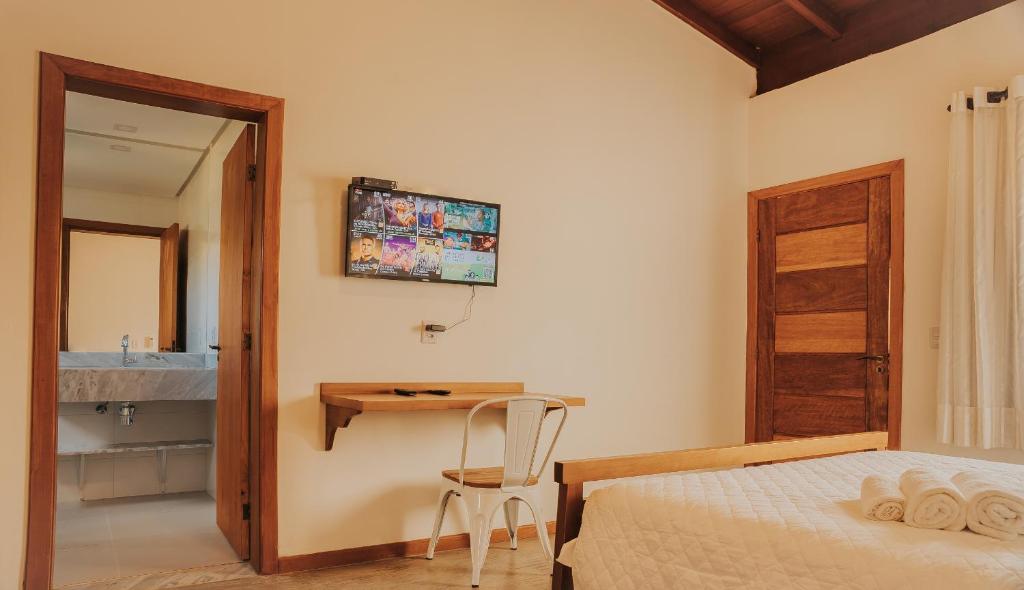 Postel nebo postele na pokoji v ubytování Pousada Cheiro da Terra