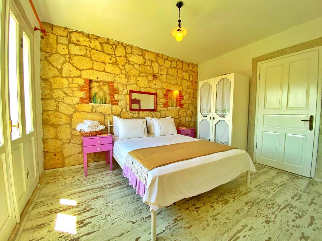 Postel nebo postele na pokoji v ubytování Kesre Hotel