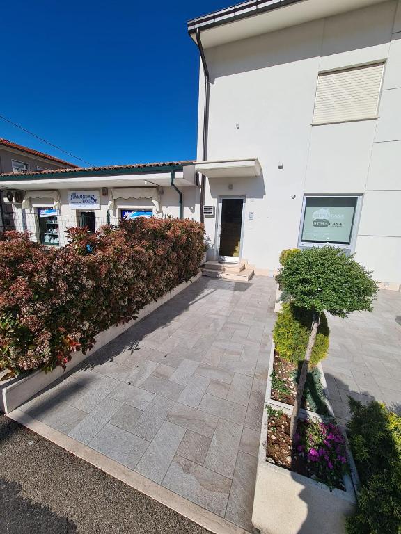 a building with a walkway in front of a building at La Casa di Fiore in Avezzano