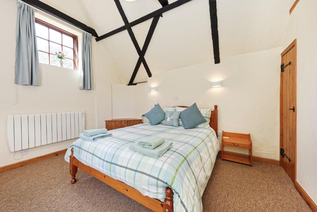 a bedroom with a bed and a window at Beachborough Park in Folkestone