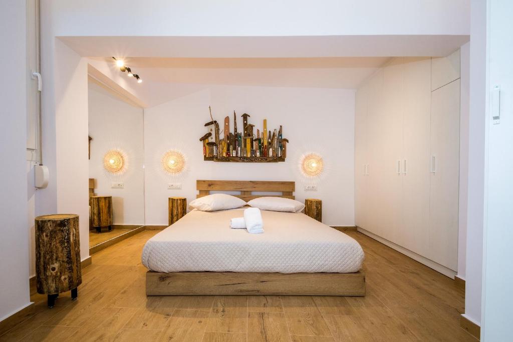 Postel nebo postele na pokoji v ubytování Magnolia Homes Zakynthos