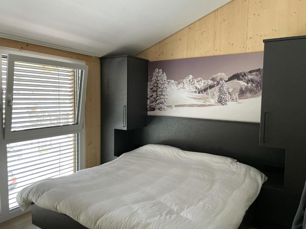 Ένα ή περισσότερα κρεβάτια σε δωμάτιο στο Familienhaus Kreischberg