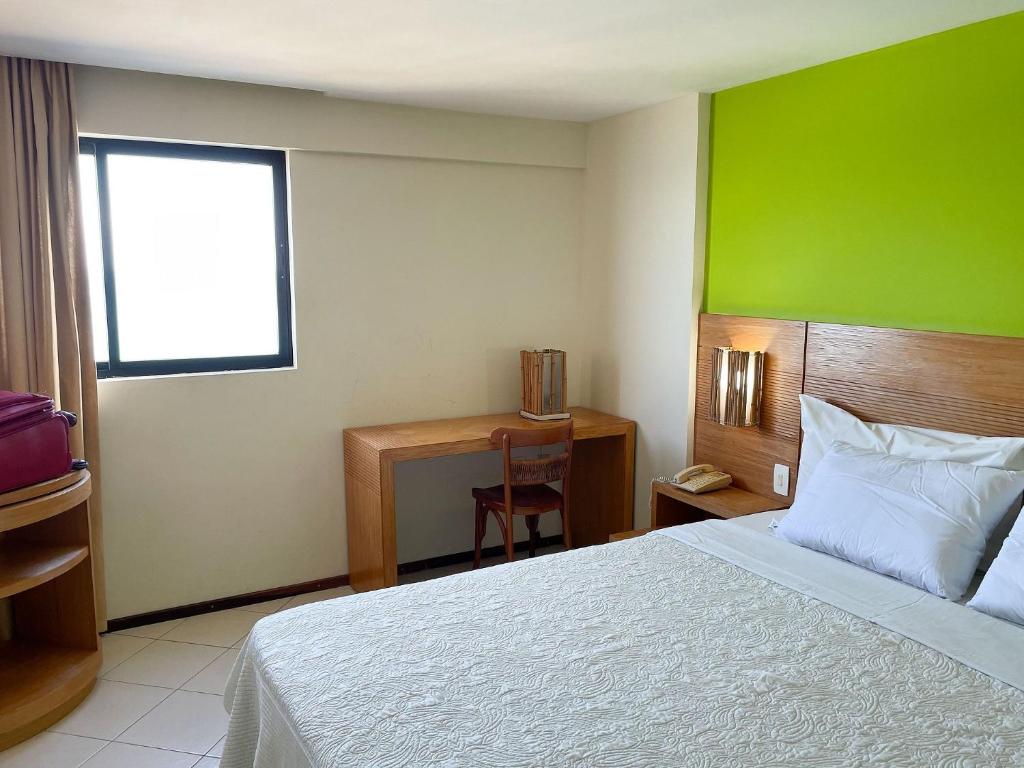  Confortável suíte com vista para praia por Carpediem