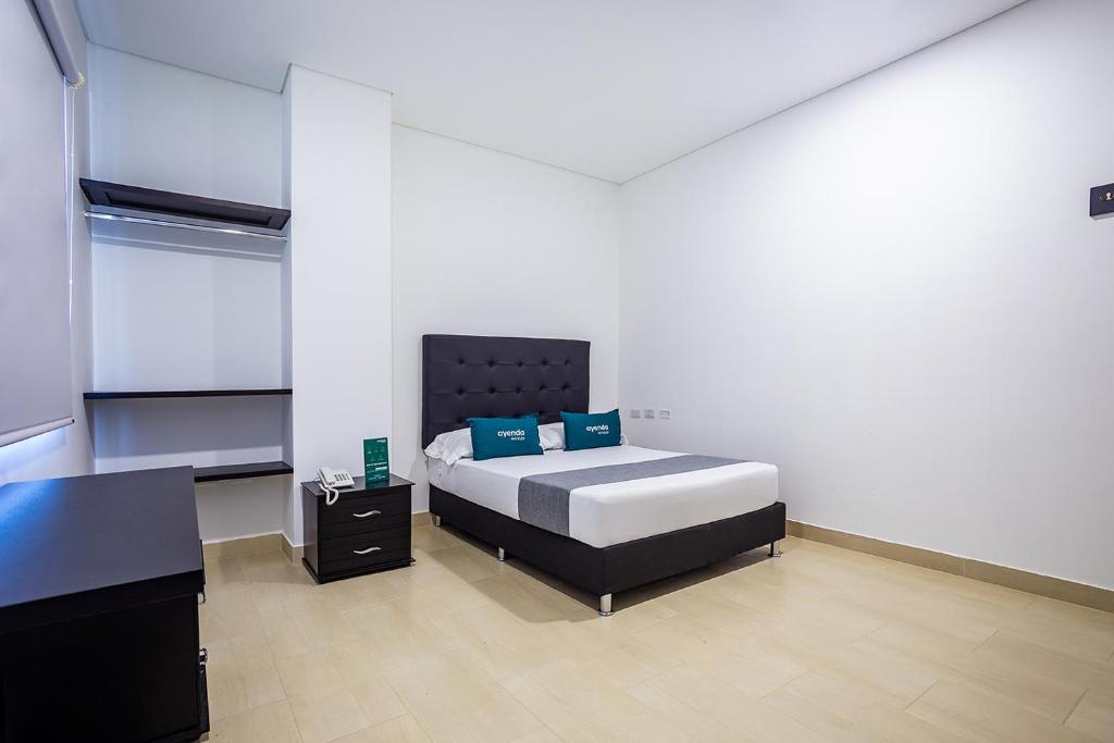 Postel nebo postele na pokoji v ubytování Ayenda Hotel Trinidad