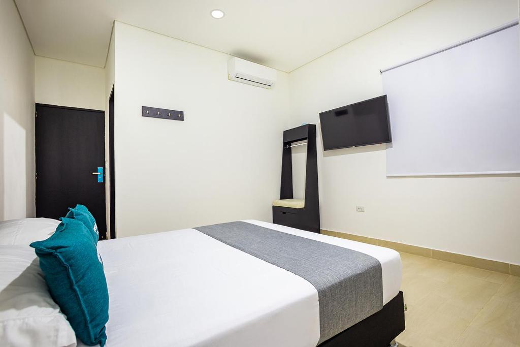 Postel nebo postele na pokoji v ubytování Ayenda Hotel Trinidad