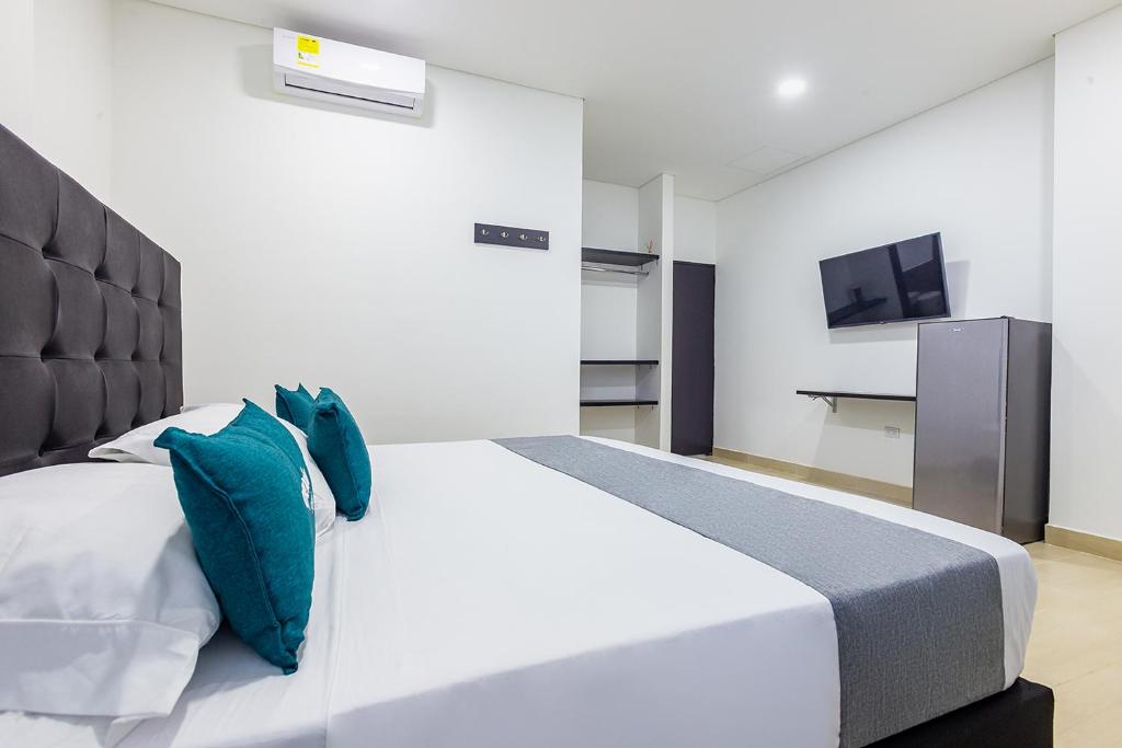 Postel nebo postele na pokoji v ubytování Ayenda Hotel Trinidad