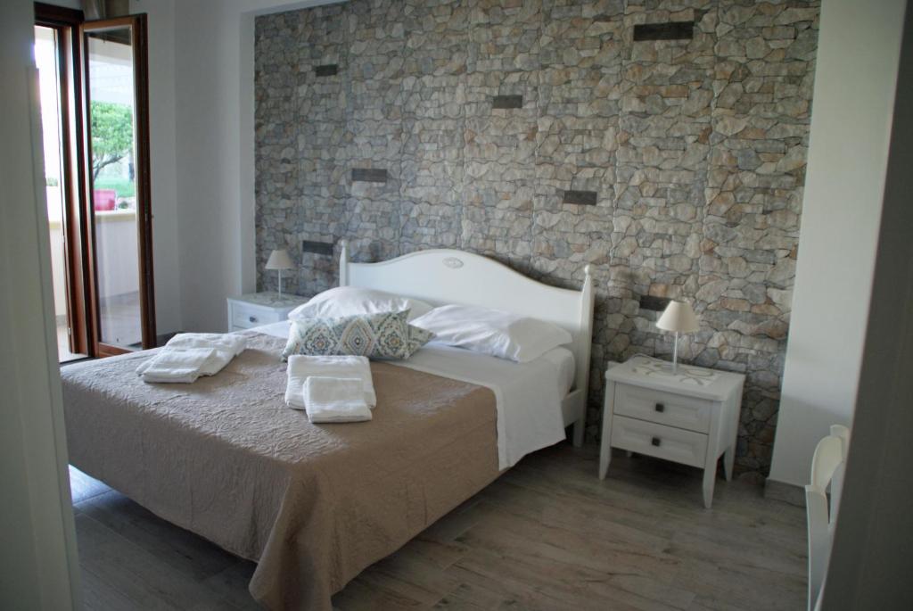 Postel nebo postele na pokoji v ubytování Stella Fenicia