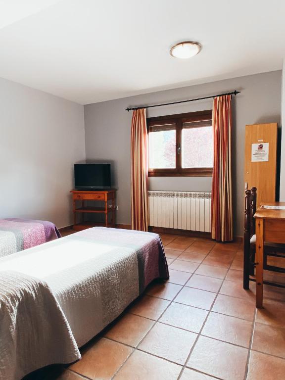 Postel nebo postele na pokoji v ubytování Hotel Valdevécar