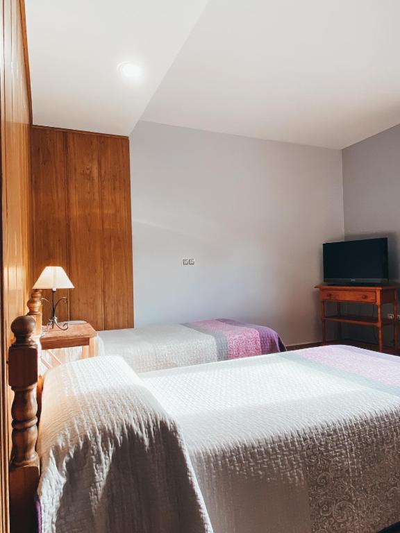 Postel nebo postele na pokoji v ubytování Hotel Valdevécar