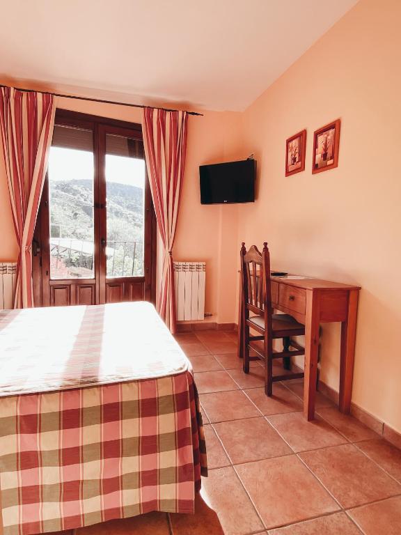 TV a/nebo společenská místnost v ubytování Hotel Valdevécar
