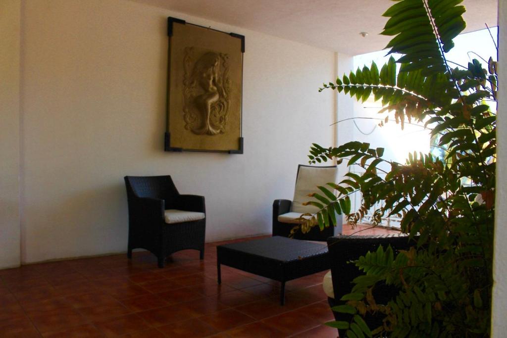 Posezení v ubytování Hotel y Suites Corita