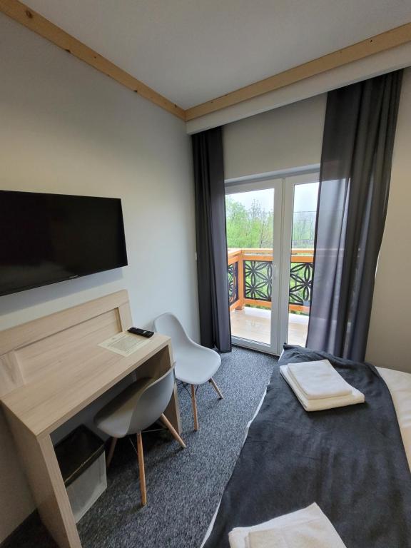 TV a/nebo společenská místnost v ubytování Karolowy pokoje&apartamenty