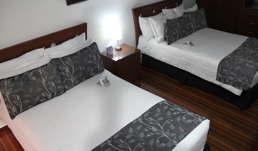 Postel nebo postele na pokoji v ubytování AW Hotel Salitre Real