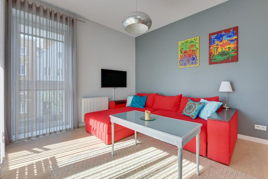 Televízia a/alebo spoločenská miestnosť v ubytovaní Comfort Apartments Kwartał Kamienic