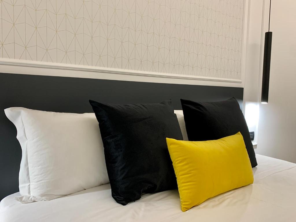 Postel nebo postele na pokoji v ubytování Toledo Boutique Rooms
