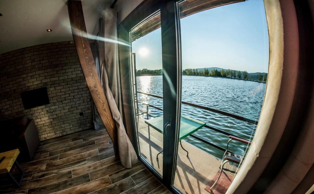 a view from the inside of a boat on the water at Boatel Copacabana in Veliko Gradište