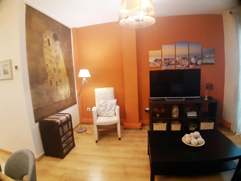Televízia a/alebo spoločenská miestnosť v ubytovaní Apartamento centro Málaga