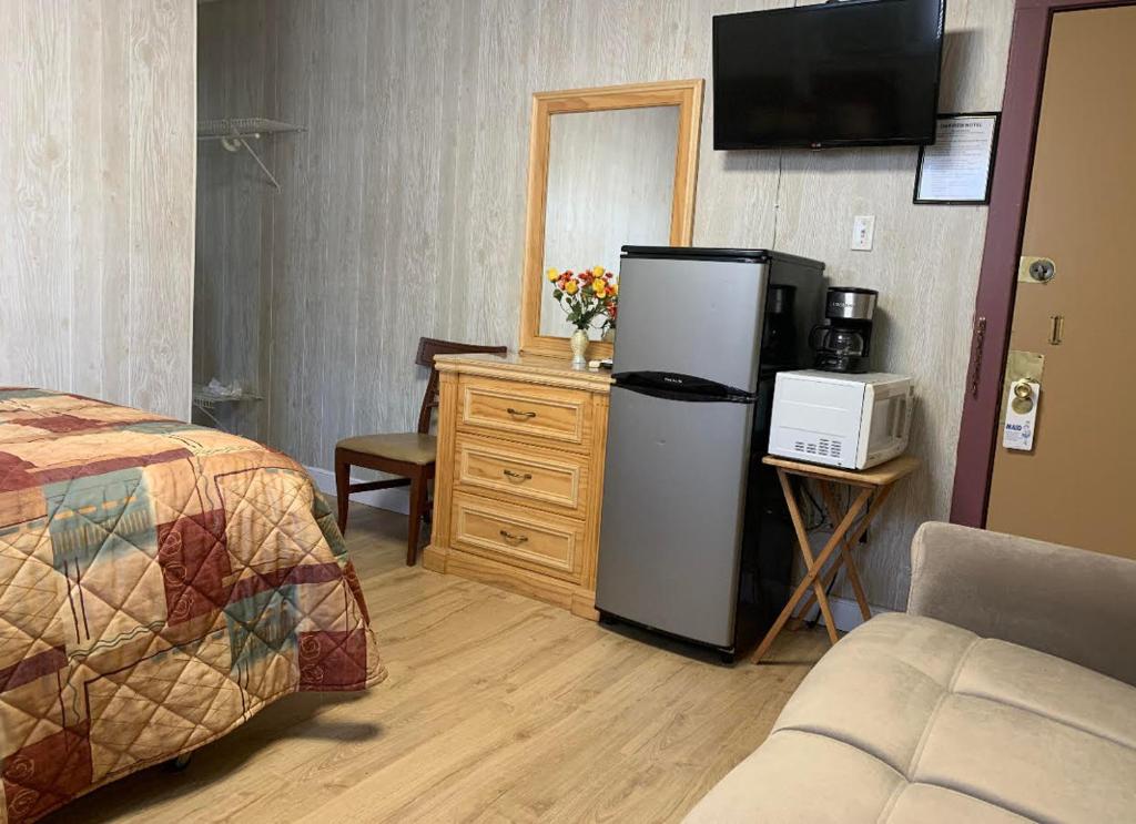 Postel nebo postele na pokoji v ubytování Oakview Hotel