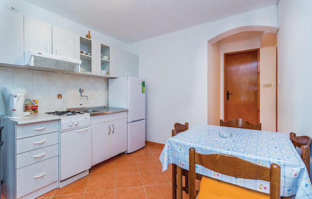 Kuchyň nebo kuchyňský kout v ubytování Apartments Vukelic