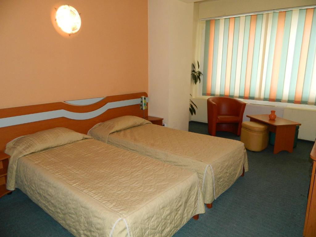 Postel nebo postele na pokoji v ubytování Elizeu Hotel